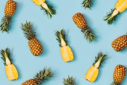 Pineapple pattern on pastel blue background