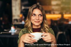 Female having coffee at cafe 5XVdQb