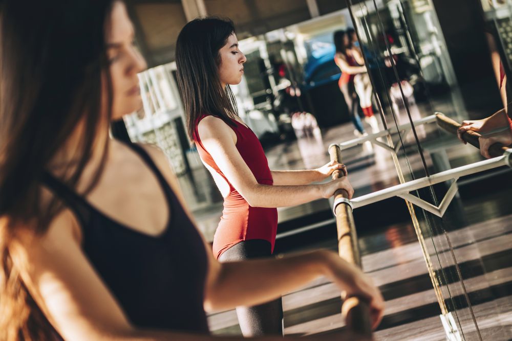 Young ballet dancer working out in studio