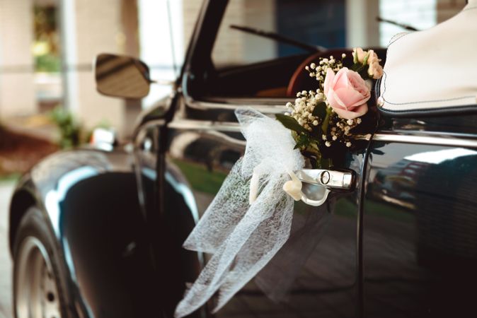 Flower on handle of retro car