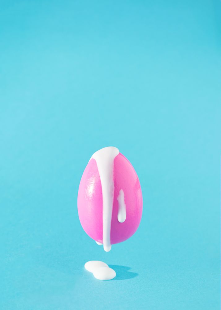 Pink Easter egg with creamy filling coming out