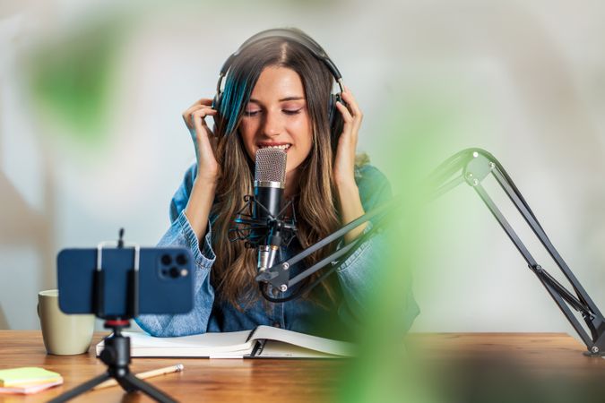 Happy Woman Recording Podcast with Microphone and Headphones - New works lifestyle