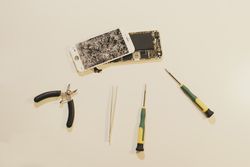 Repair tools near broken smartphone
