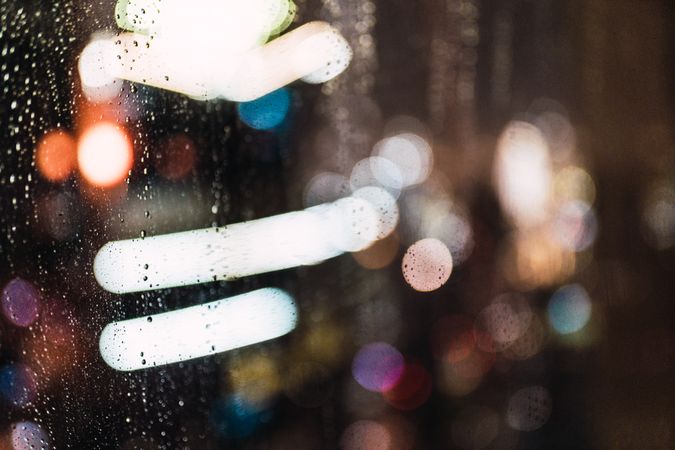 Night city through wet glass