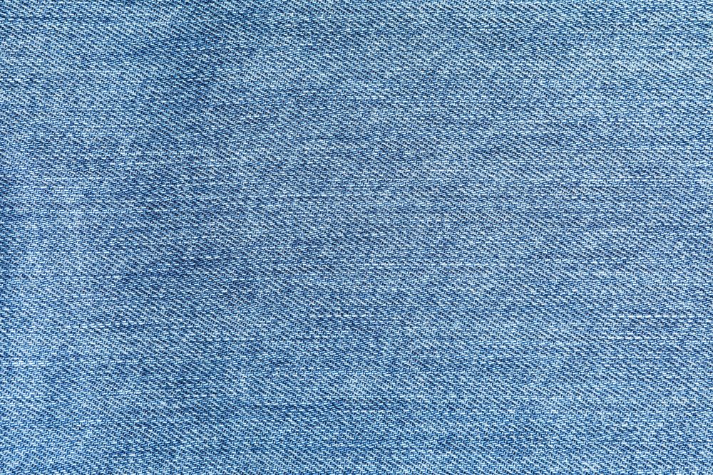 Texture of blue jeans as background, space for text