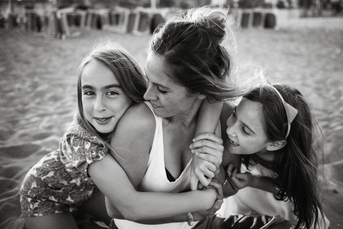 Playing woman with kids on beach