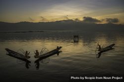 Fishermen on their boats at sunset in Myanmar 4dWya5