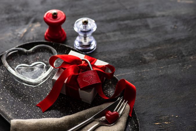Valentine's day gift box with red lock on table setting