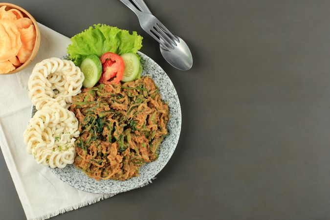 Top view of lotek, Sudanese vegetable salad with peanut dressing with space for text