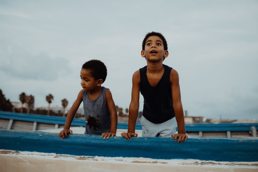 Amazed Black boys on boat