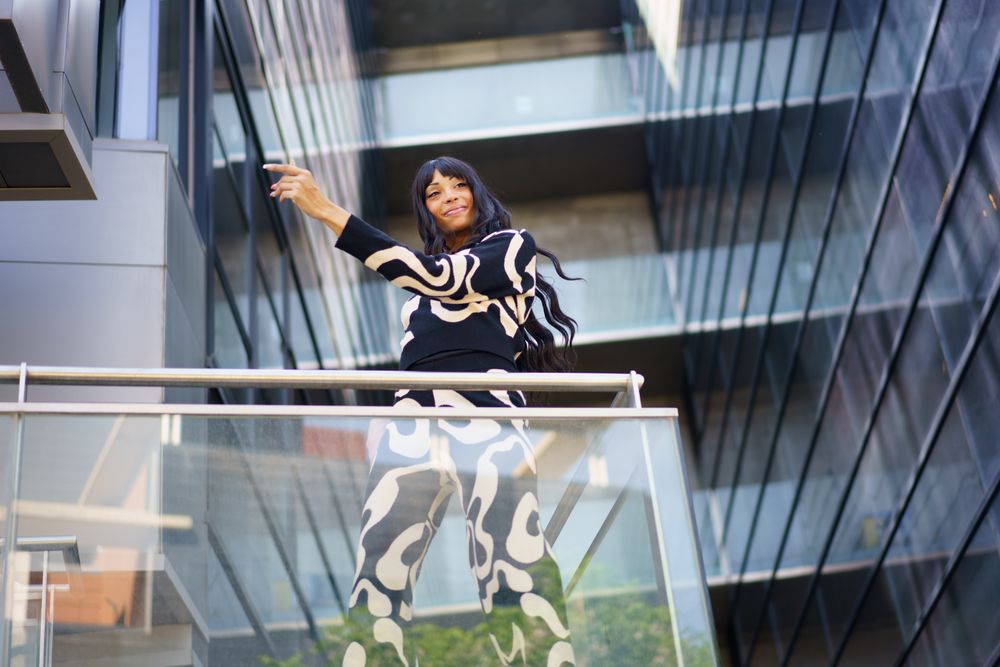 Dancer performing choreography from urban stairs