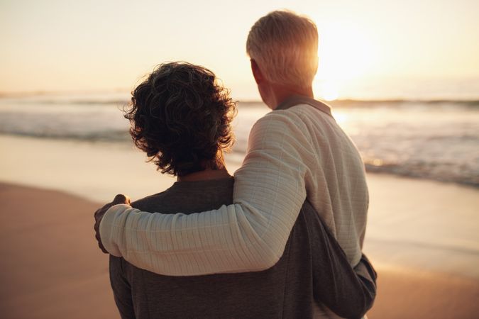 Rear view shot of older couple watching amazing sunset
