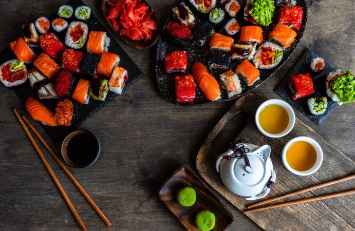 Top view of sushi platter served with tea