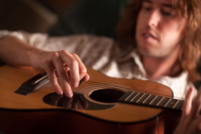 Young Musician Plays His Acoustic Guitar