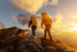 hiking in the mountains at sunset