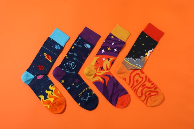 Casual clothes and wearing concept - socks, clothes for foot