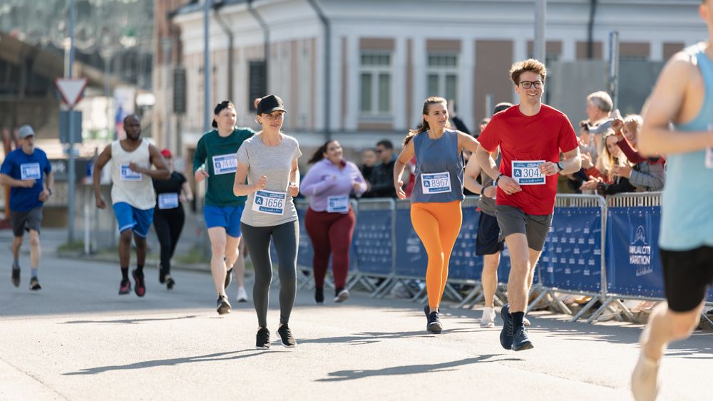 Smiling Group of People Participating in a City Marathon.