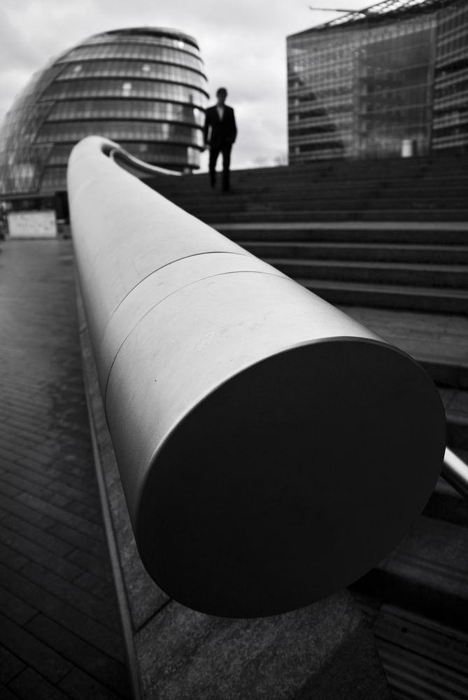 Monochrome photo of man standing near handle
