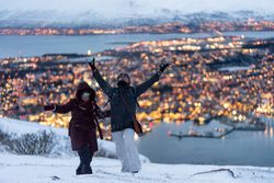 Cheerful couple having fun in snowy weather