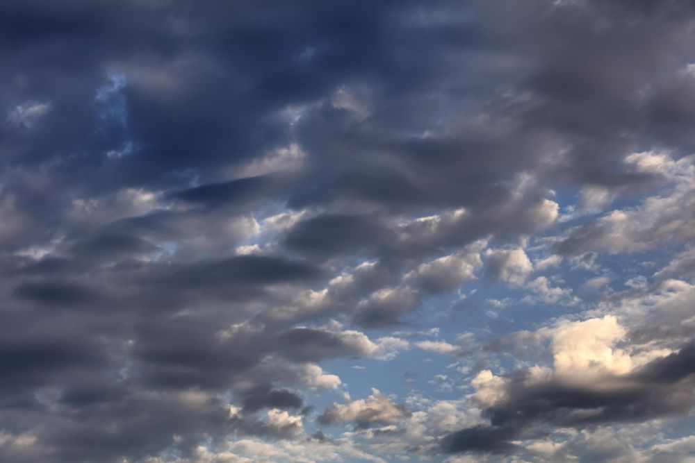 Dark and light cloudy sky background