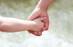 Hands of mother and child