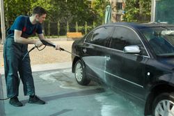 A man washes a car. Clear car concept