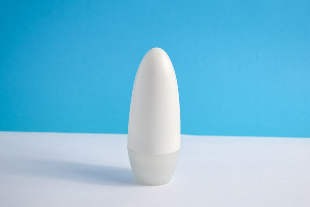 Mock up cosmetic bottle in a blue room