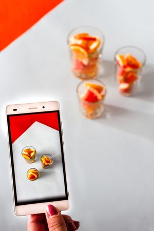 Photo of sliced citrus fruits on mobile phone