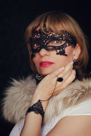 Portrait of woman wearing lace masquerade