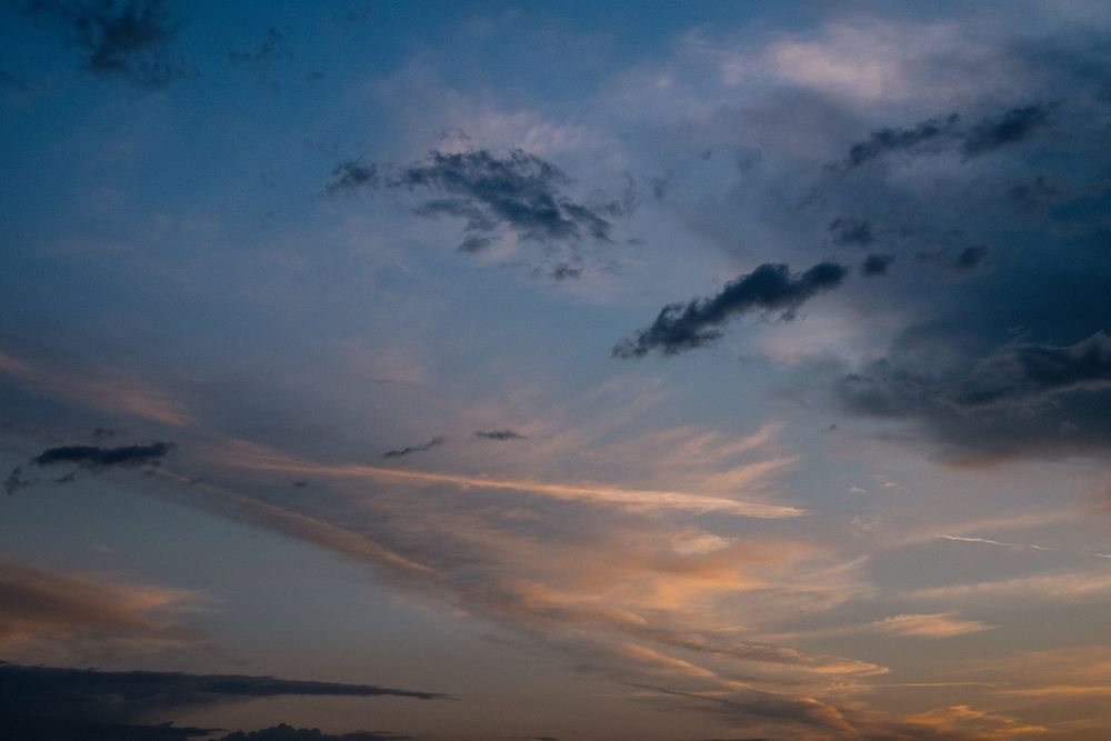 Scattered dark and light clouds in the evening
