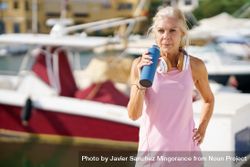 Older female drinking between  exercise 5nGRD4