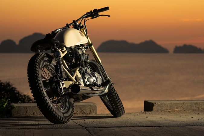 Motorbike near sea during sunset
