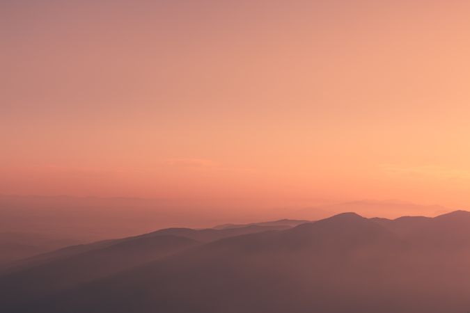 Sunset sky over mountain ridge