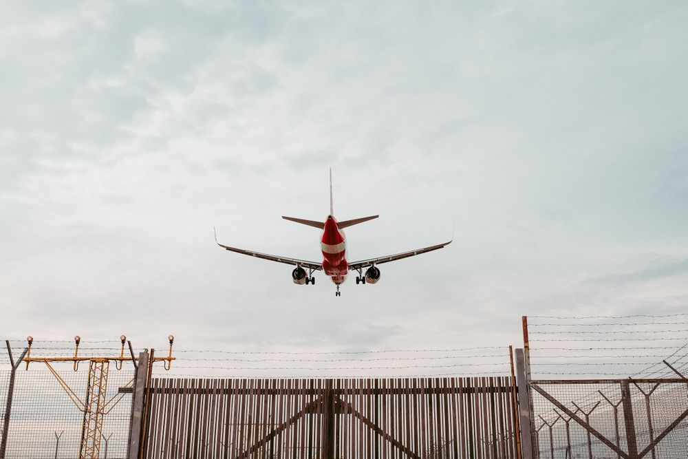 Rear view of airplane landing