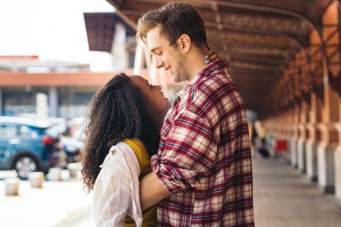 Cute couple meeting at the station after a trip