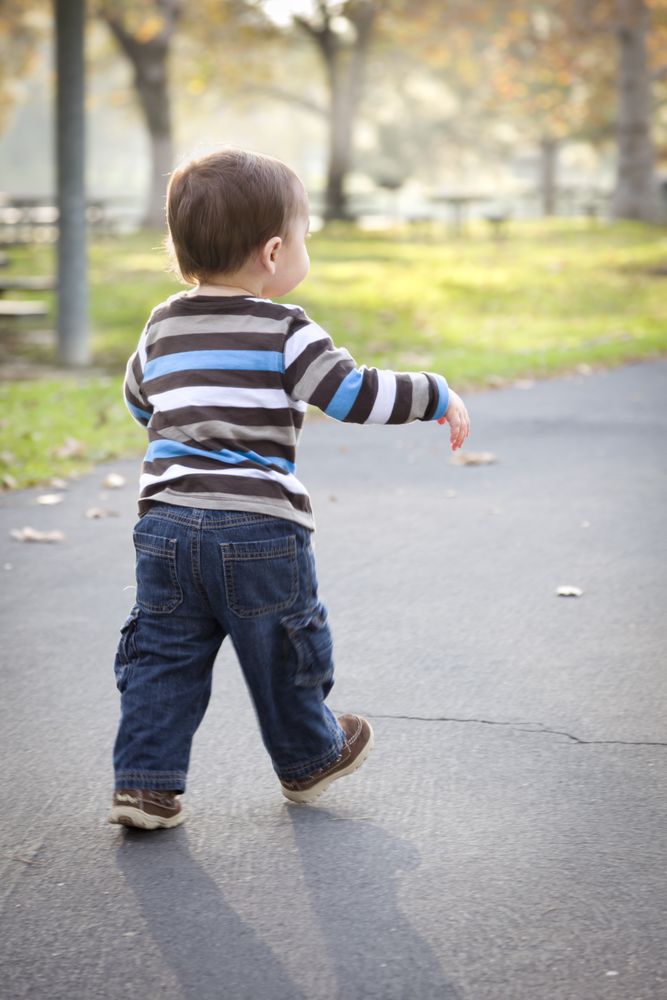 Young Baby Boy Walking in the Park