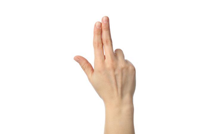 Woman hand showing three fingers, isolated on plain background