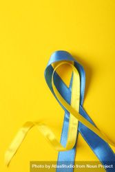 Vertical composition of ribbon in Ukrainian flag colors on yellow background 5QGxEb