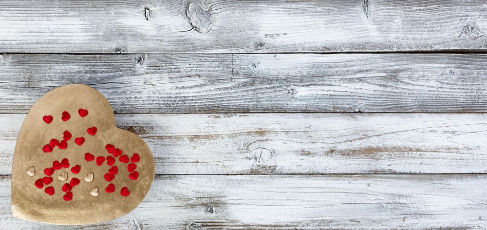Valentine’s Day with large gold heart on wood