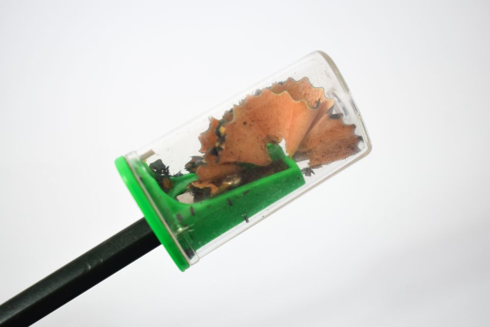 Side view of pencil sharpenings from freshly sharpened pencil