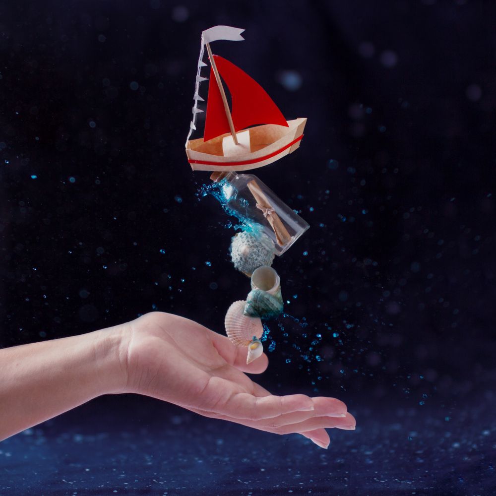 Charming composition of toy boat and seashells