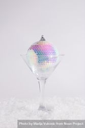 New Year disco bauble ornament captured in a martini glass 48YzKb