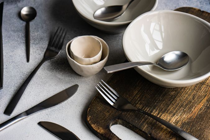 Chic cutlery set on concrete background