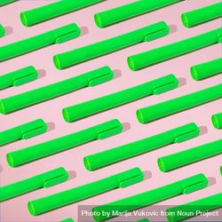 Rows of green highlighter on pink background with shadow 0yLWab