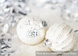 Christmas holiday baubles on silvery background 5lApo4