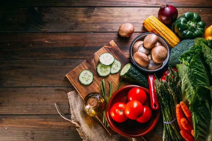 Vegetables and utensils on kitchen table