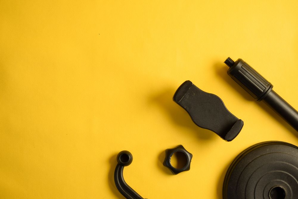 Phone accessories on yellow background, with space for text