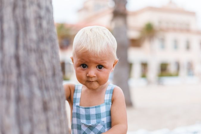 Portrait of a blonde baby boy on the beach