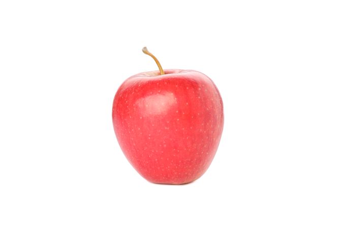 Sweet red apple isolated on light background