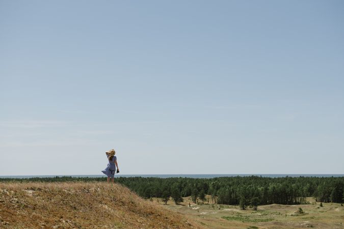 Young female photographer on forest
